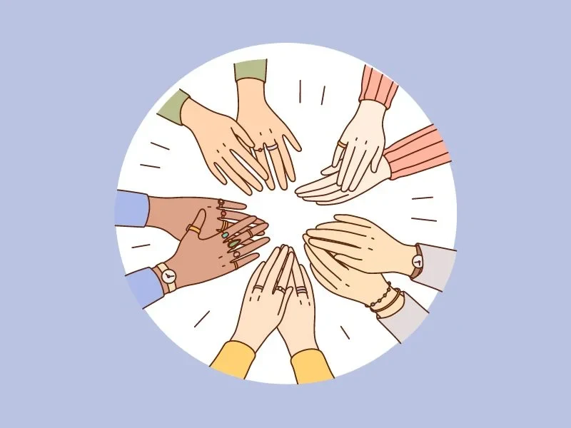 five pairs of hands coming together in a circle